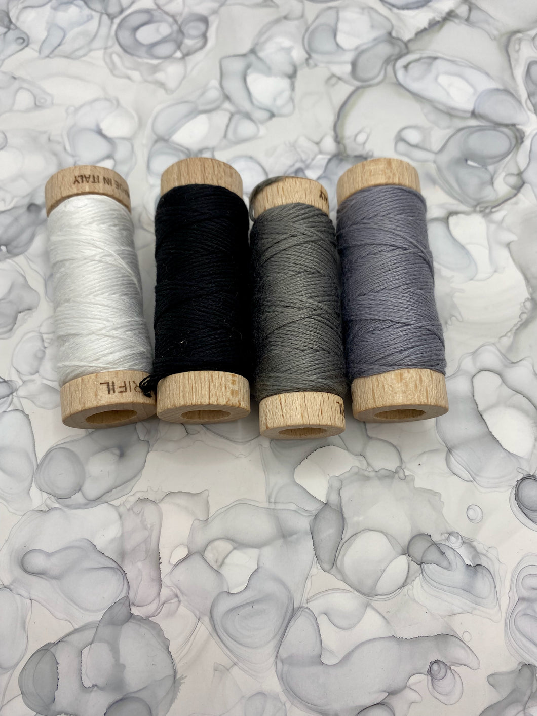 Aurifil Greys, White, and Black Set of four 6-strand embroidery floss spools